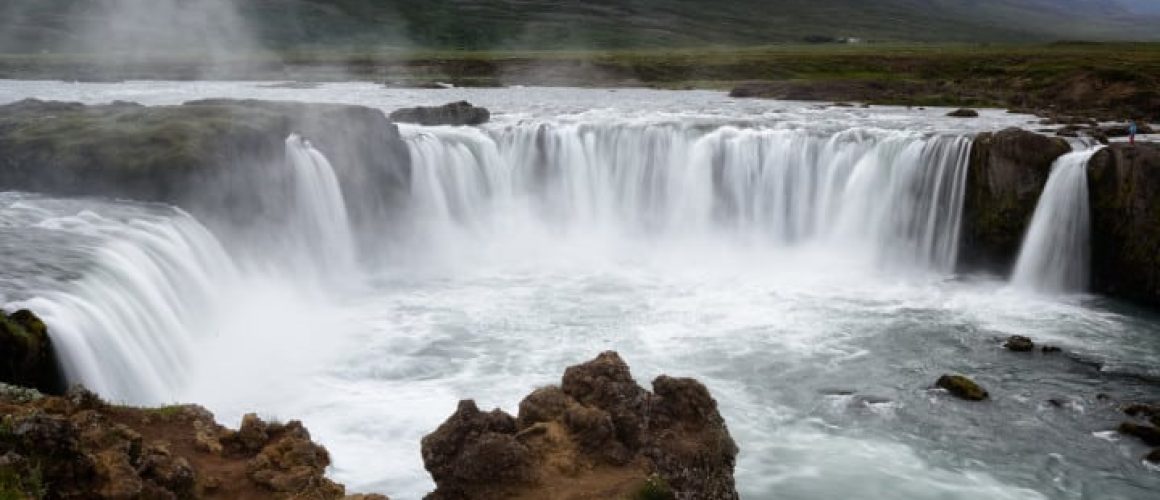 Waterfalls flowing into the river below.