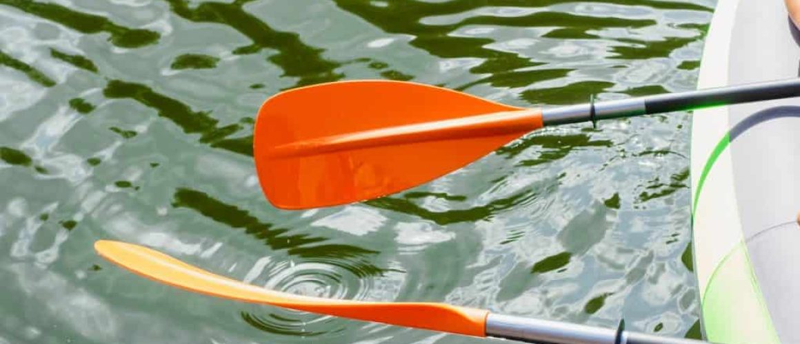 a couple of kayaks floating on top of a body of water