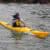 Sea kayak paddler navigating ocean waters